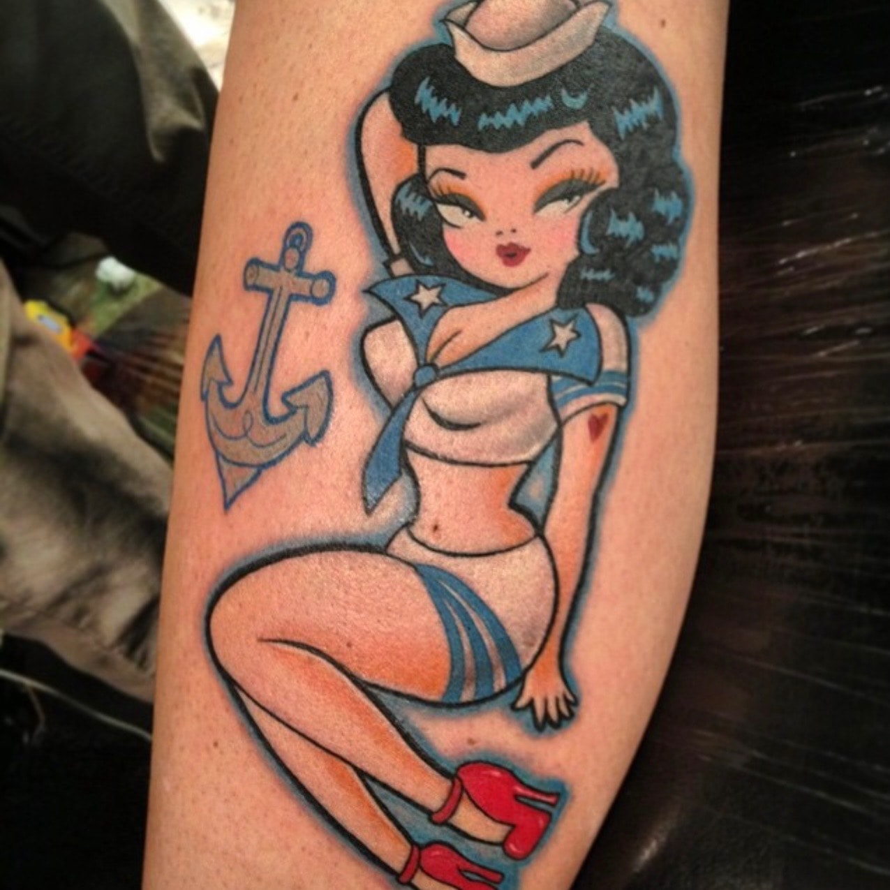 Traditional sailor pin-up with anchor tattoo by Ruthless