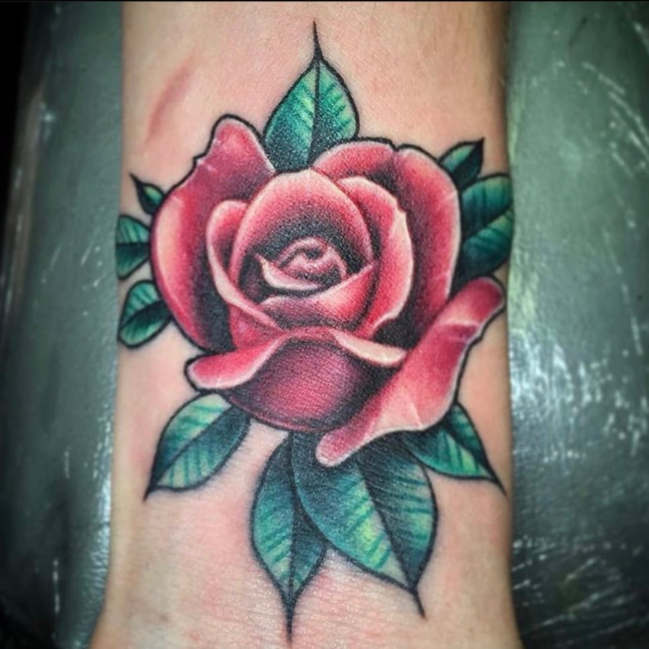 Traditional red rose tattoo by Ruthless